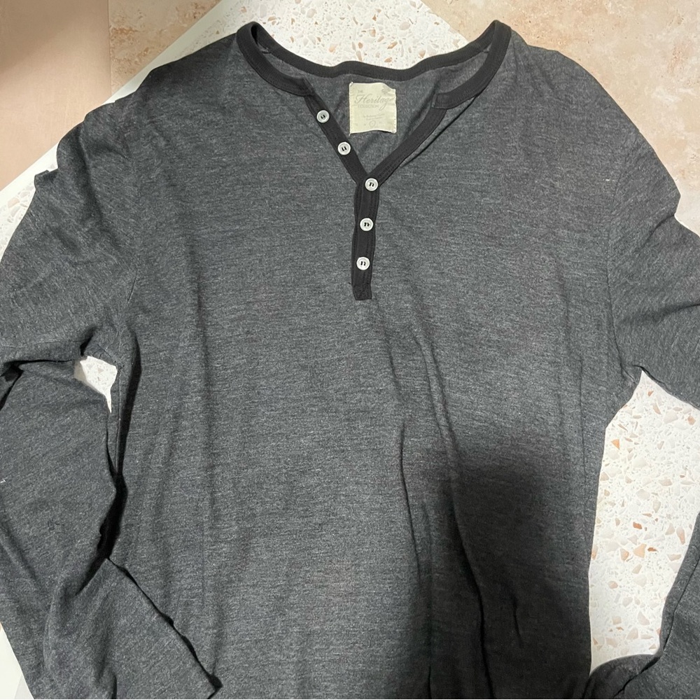 Men’s large, casual fit grey Henley with black accents.